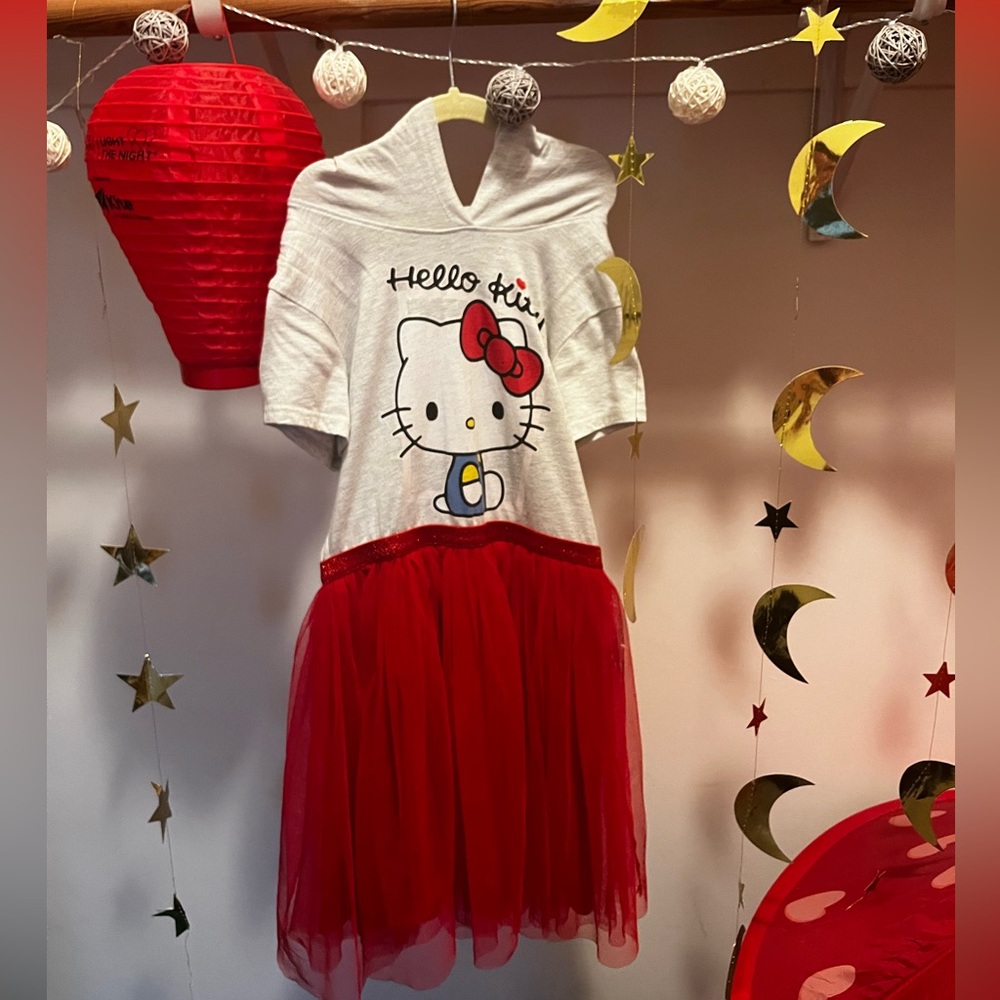 Super cute Hello Kitty dress size L. Cute ear hood detail and tutu skirt.